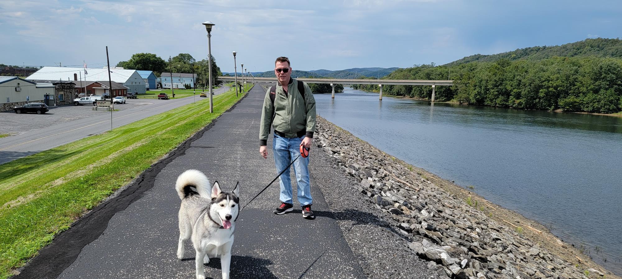 Shawn-and-Jasper-on-the-high-riverwalk-wall-in-Lock