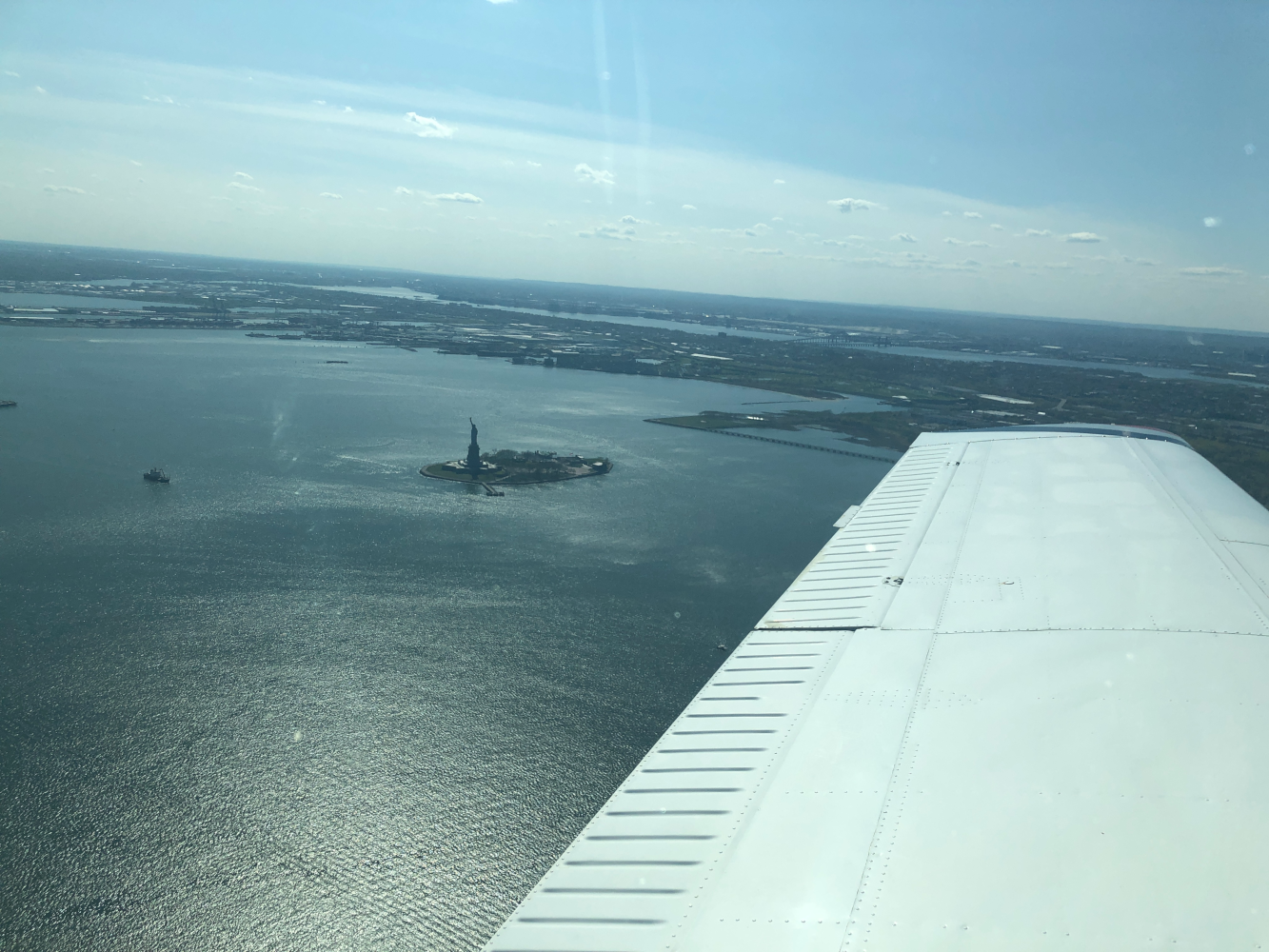 Statue-of-Liberty-passing-behind-the-left-wing-1100-MSL