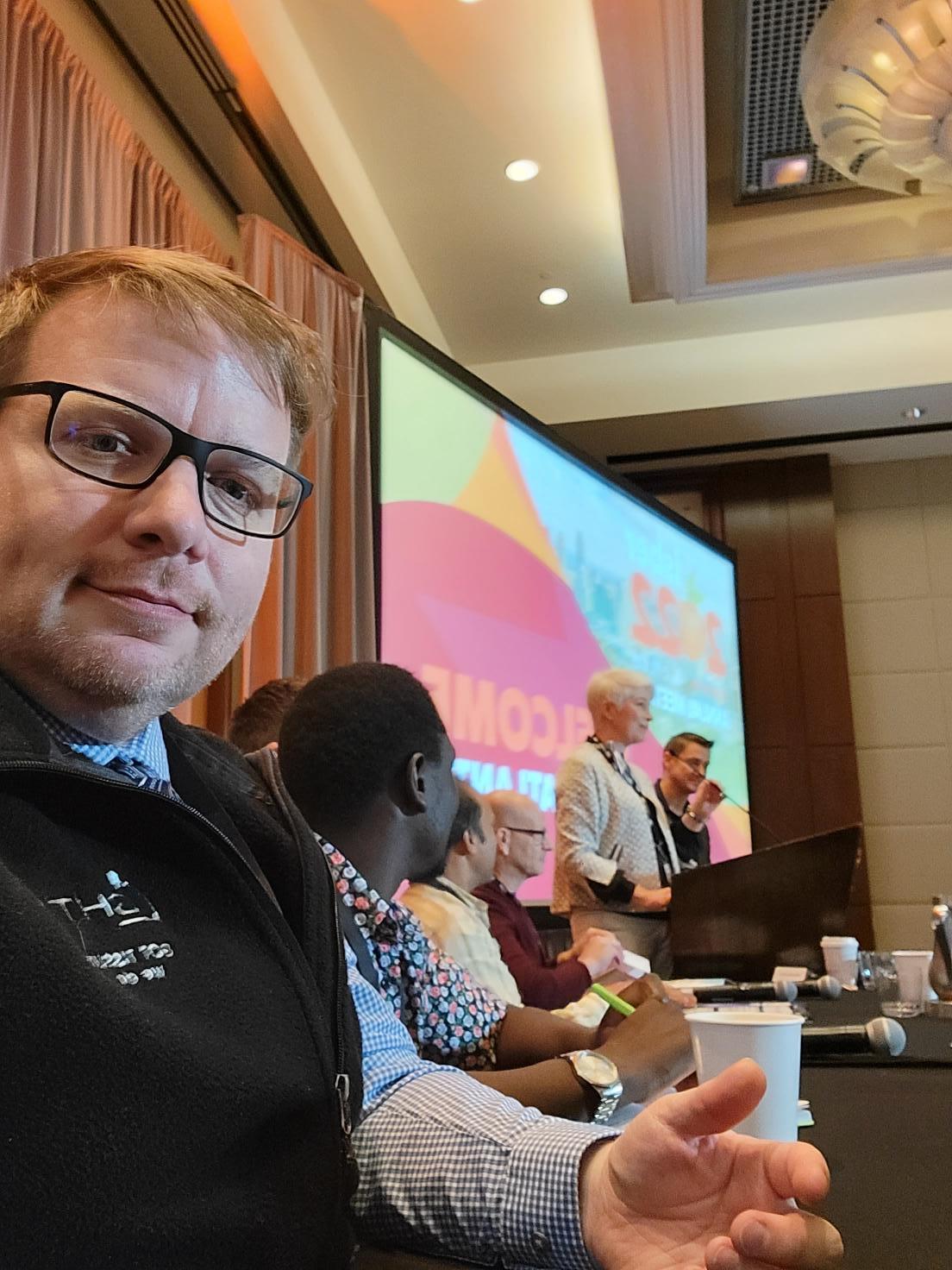 Zack-getting-ready-for-the-conference-panel-discussion