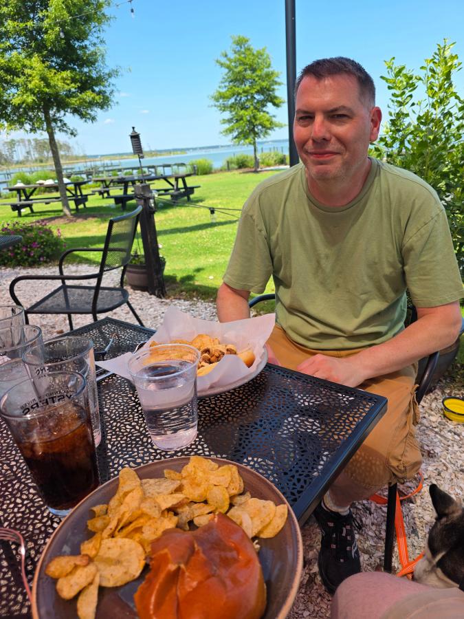 Shawn-enjoying-the-scenery-and-lunch-at-Merroir-Restaurant