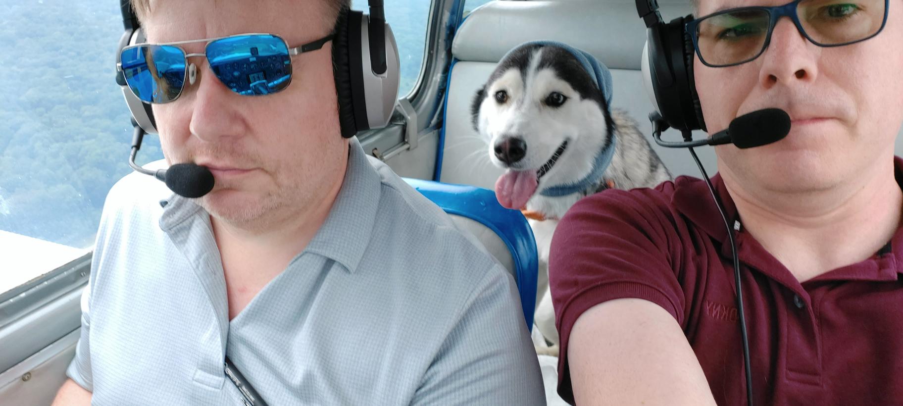 Jasper-in-the-backseat-with-ear-protection-on-during-approach
